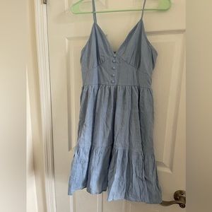 Blue tiered sundress with spaghetti straps and eyelet embroidery
